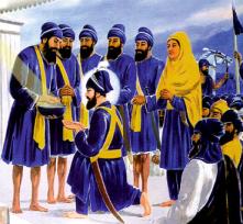 The Guru takes Amrit from his Disciples